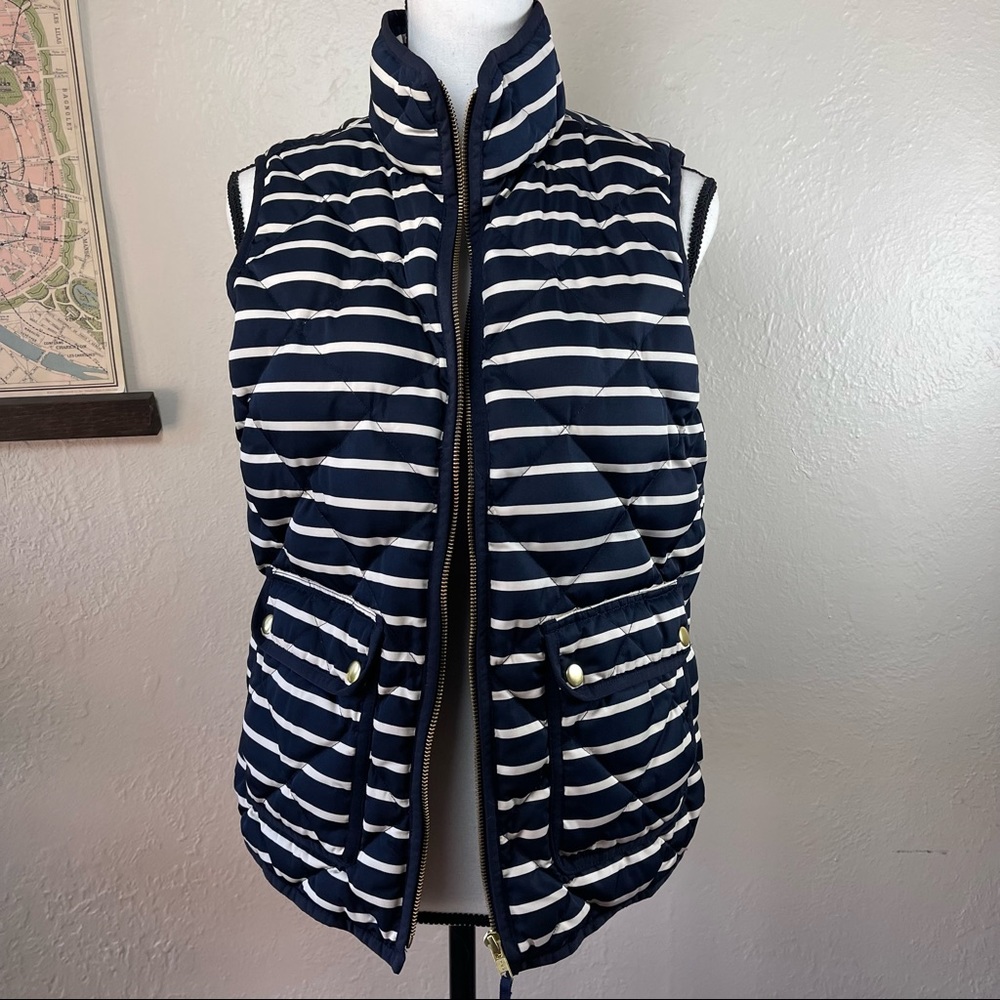 Navy and cream striped puffer vest.
